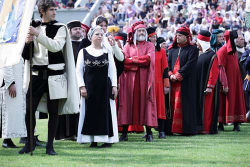 participants in mediaeval costume on field at the Corsa all'anello in Narni Umbria